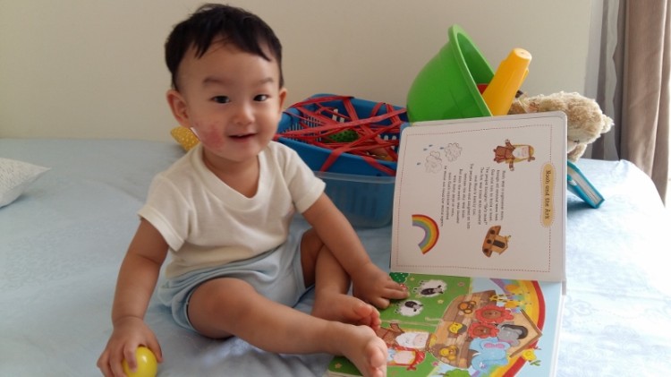 15 months old - love reading time eventhough it's the same book all over again.