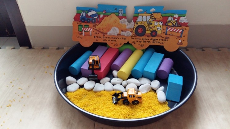 16 months old - construction theme sensory bin. Super messy!